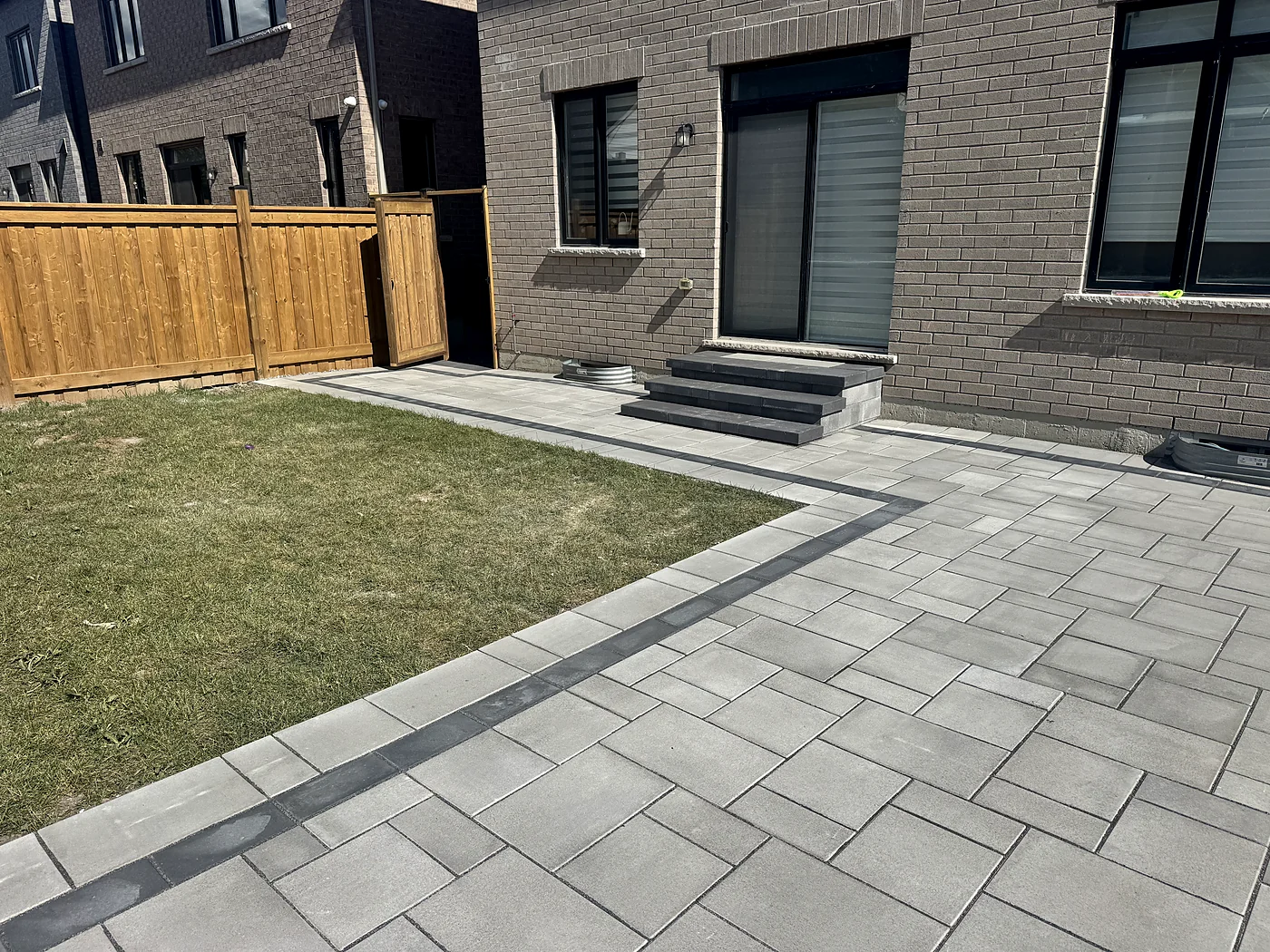 Completed interlock patio and steps in the featured GTA backyard project